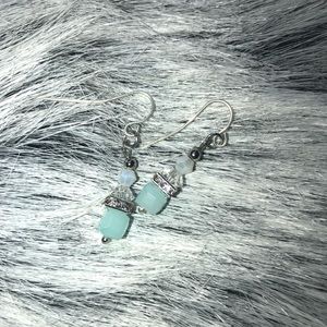 Handcrafted blue dangle earrings.